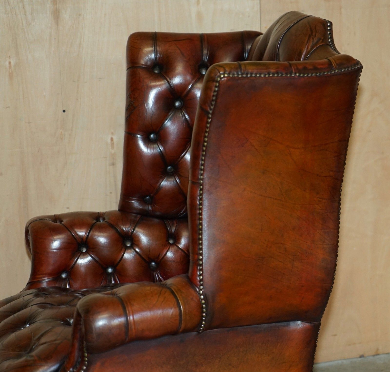 photo vintage Antique Fully Restored Bordeaux Leather Tufted Chesterfield Wingback Armchair