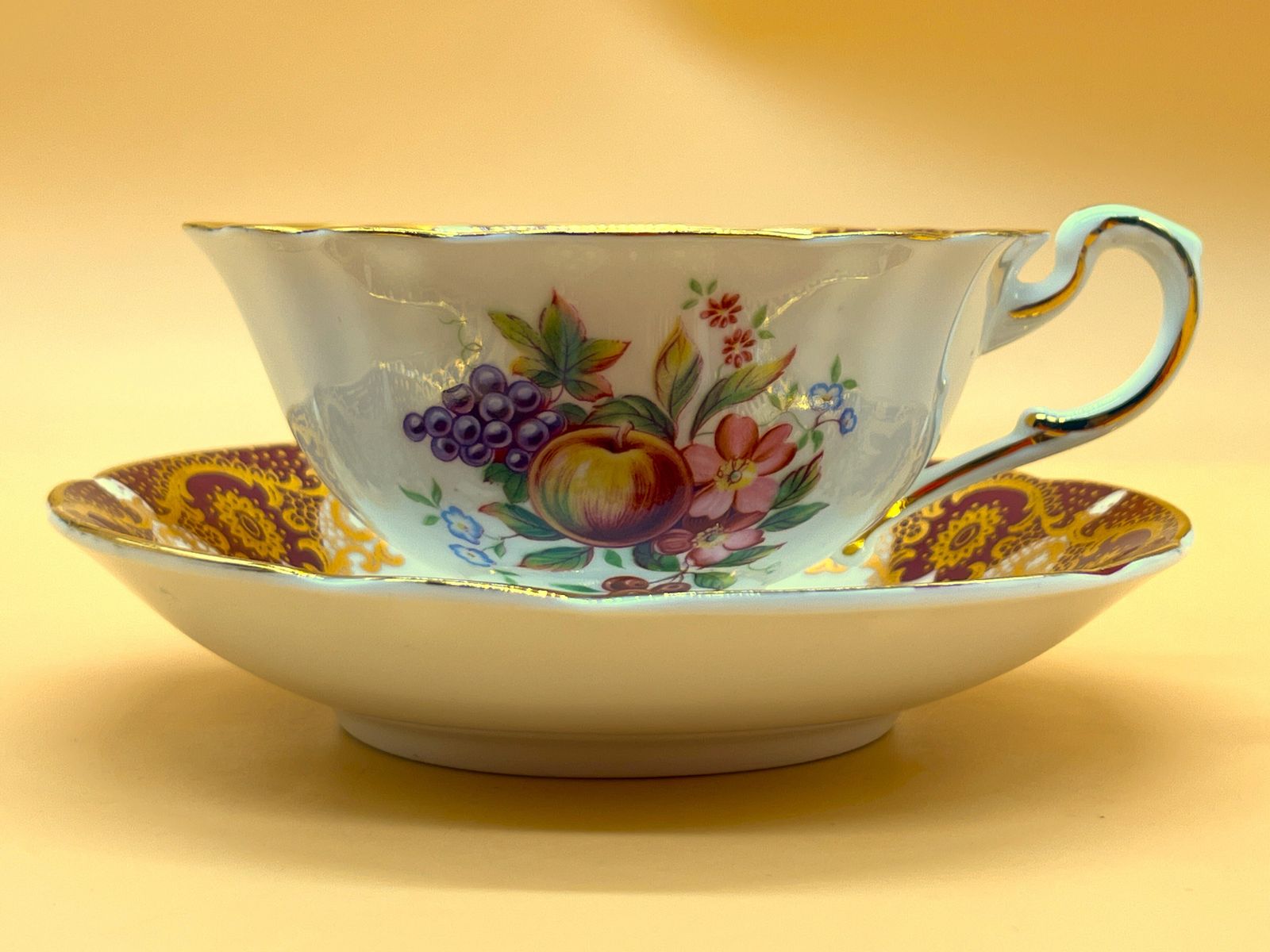 photo for sale Vintage Paragon China Quatrefoil Shape Red And Gold With Pink Chintz Centre Tea Cup And Saucer Duo.
