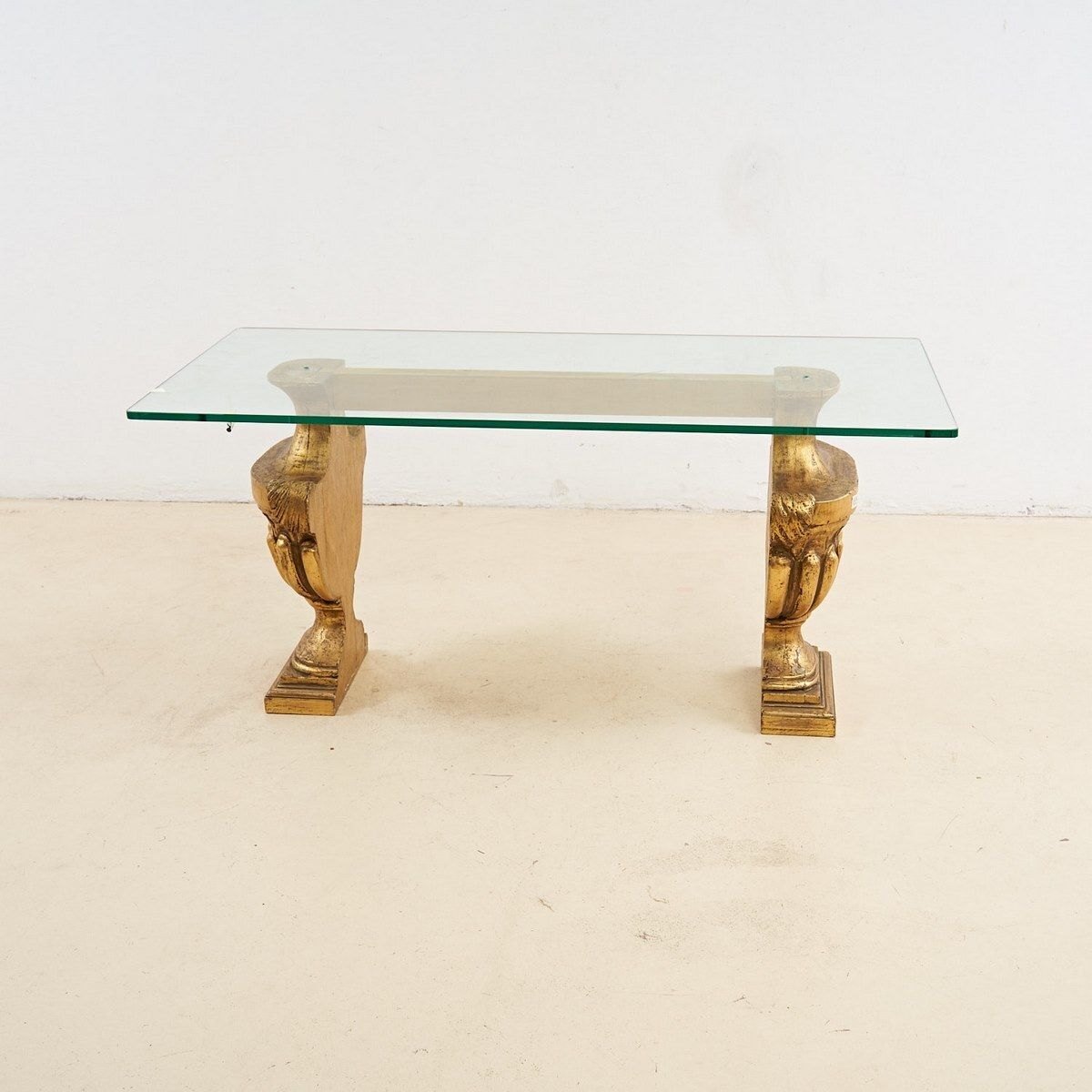 Glass Top Coffee Table With Gilded Wooden Capitals