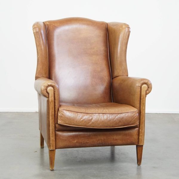Charming, Timeless And Characterful Cowhide Wing Chair In A Light Cognac Color Finished With A Matching Piping