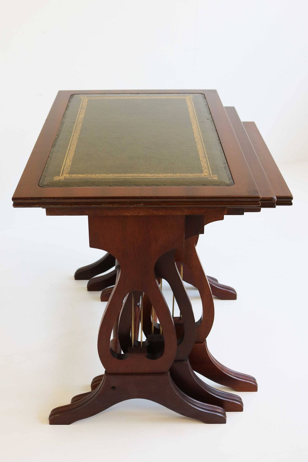 Mid Century Wooden Nesting Tables With Green Leather Tops Harp Shaped Legs Set Of Three Sides Tables Antique Style Nest Of Tables Mimiset 70 photo vinterior