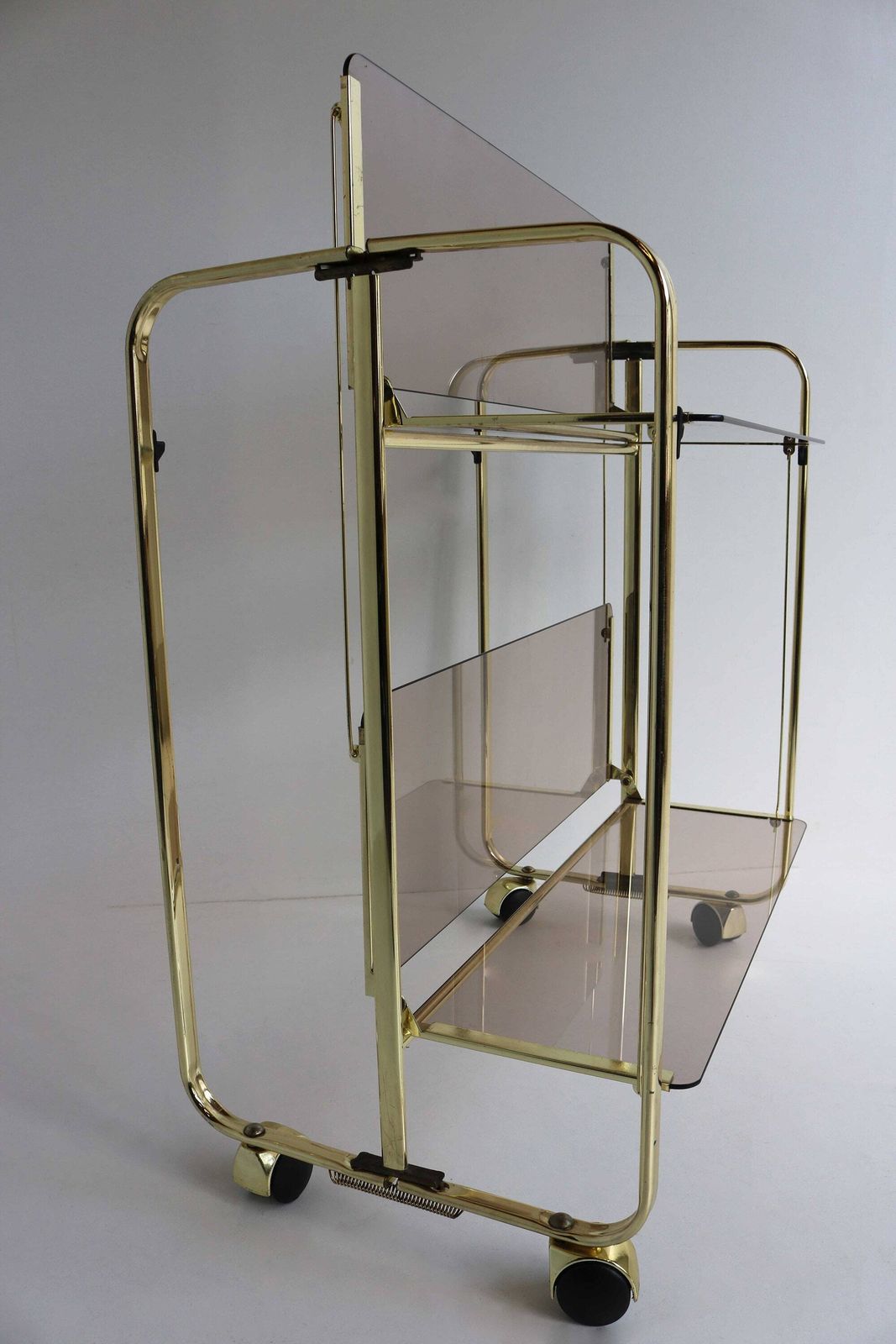 Midcentury Golden Foldable Barcart Teacart Cocktailcart Brass Entertainment Cart Hollywood Serving Cart Display Cart Smoked Glass 1970 photo vintage