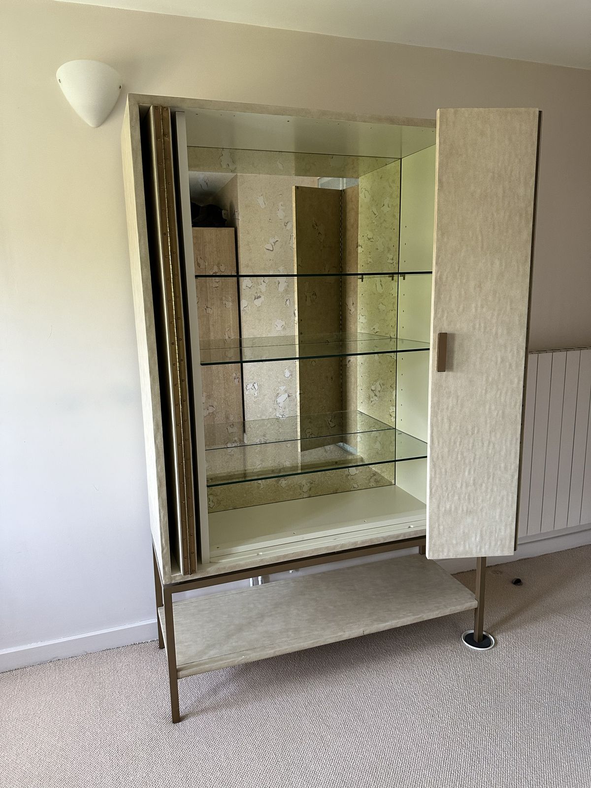 A Gorgeous Drinks Cabinet With Beautiful Panelled Doors And A Gilded Metal Base. Inside It Has An Ornate Mirrored Back With Glass Shelves For A Special Display. The Doors Can Be Neatly Folded Away. photo furniture