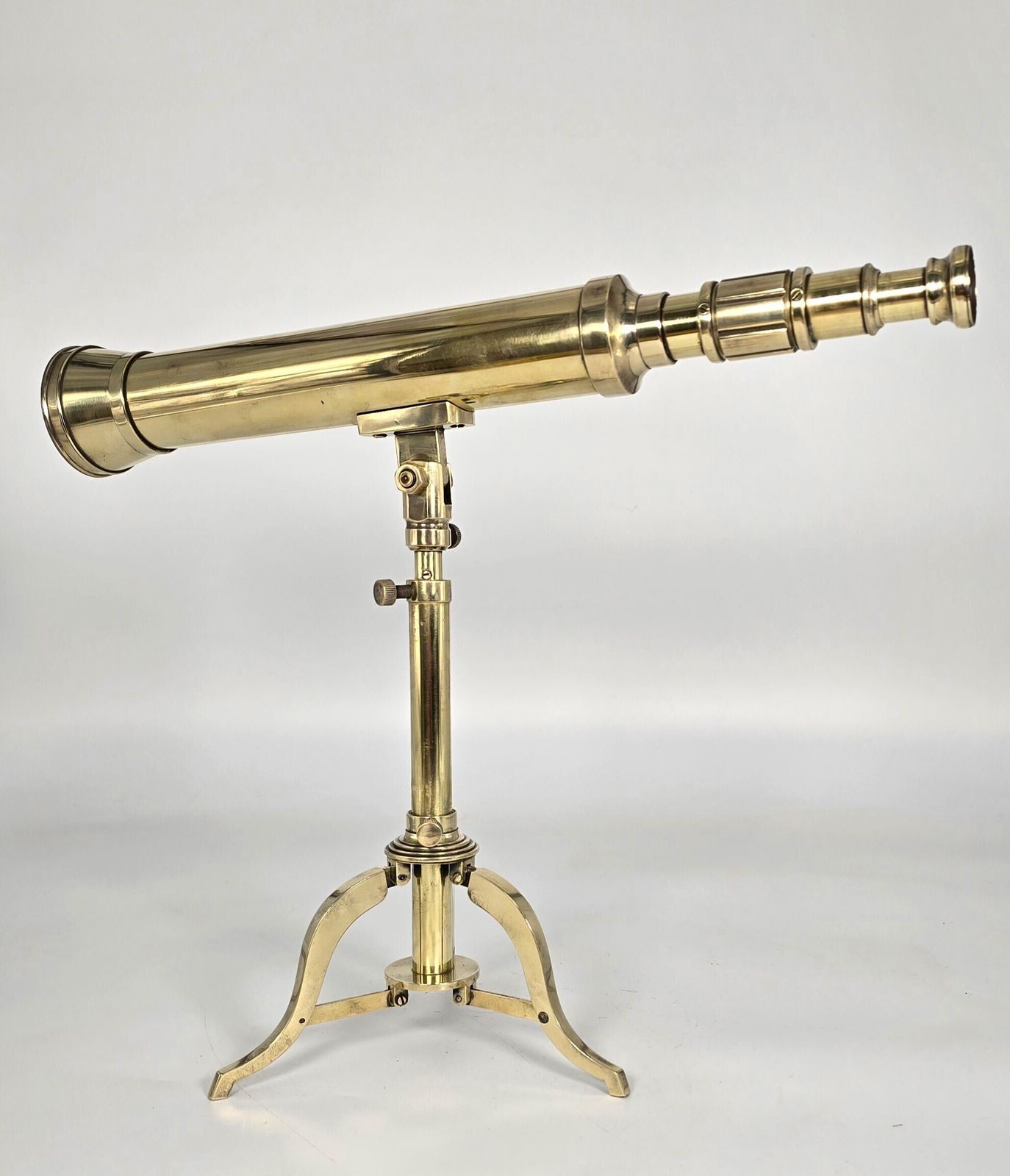 A Small Mid 19th Century Brass Telescope With An Original Folding Brass Tripod Stand. photo furniture