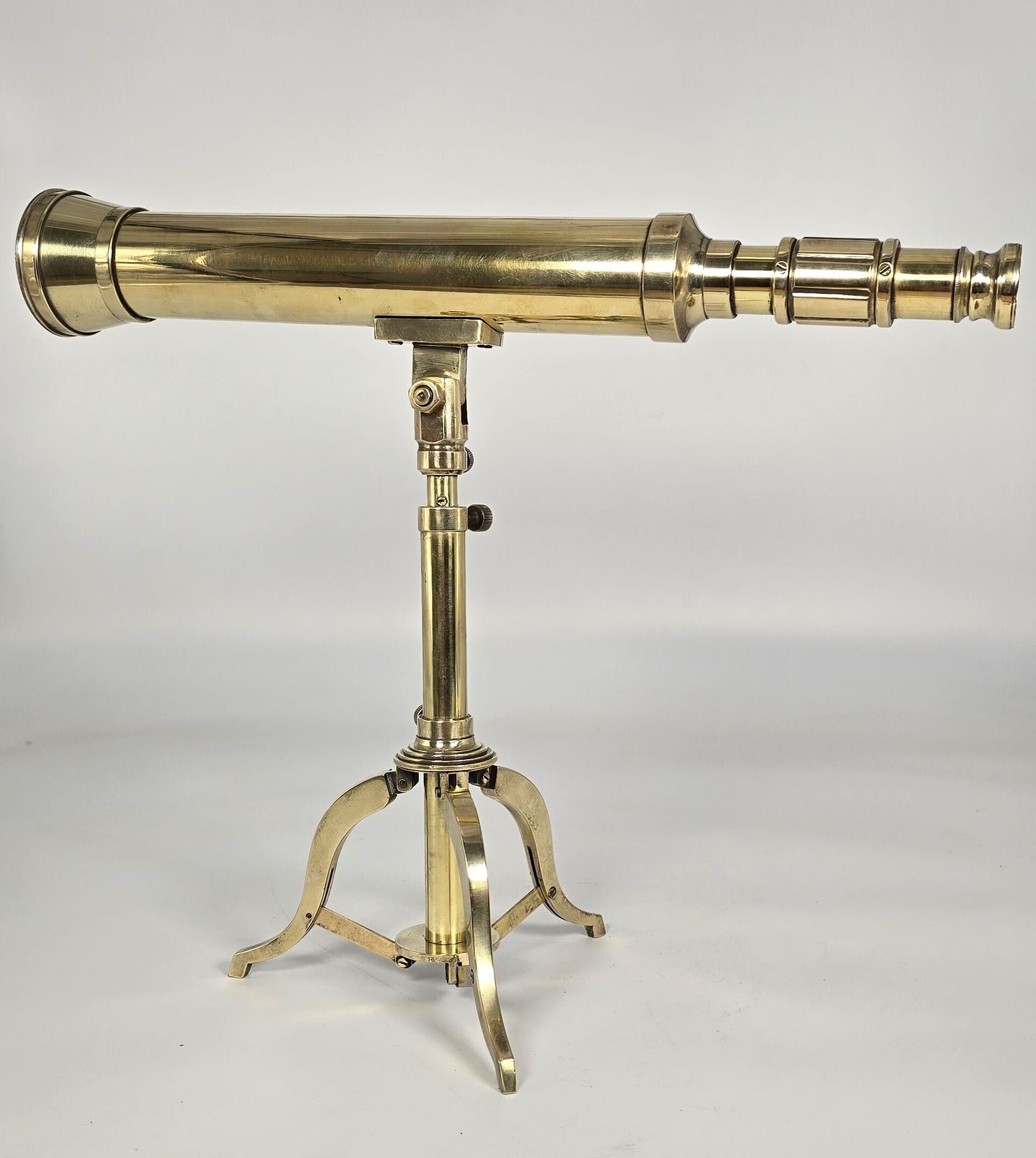 1250.0 A Small Mid 19th Century Brass Telescope With An Original Folding Brass Tripod Stand. photo