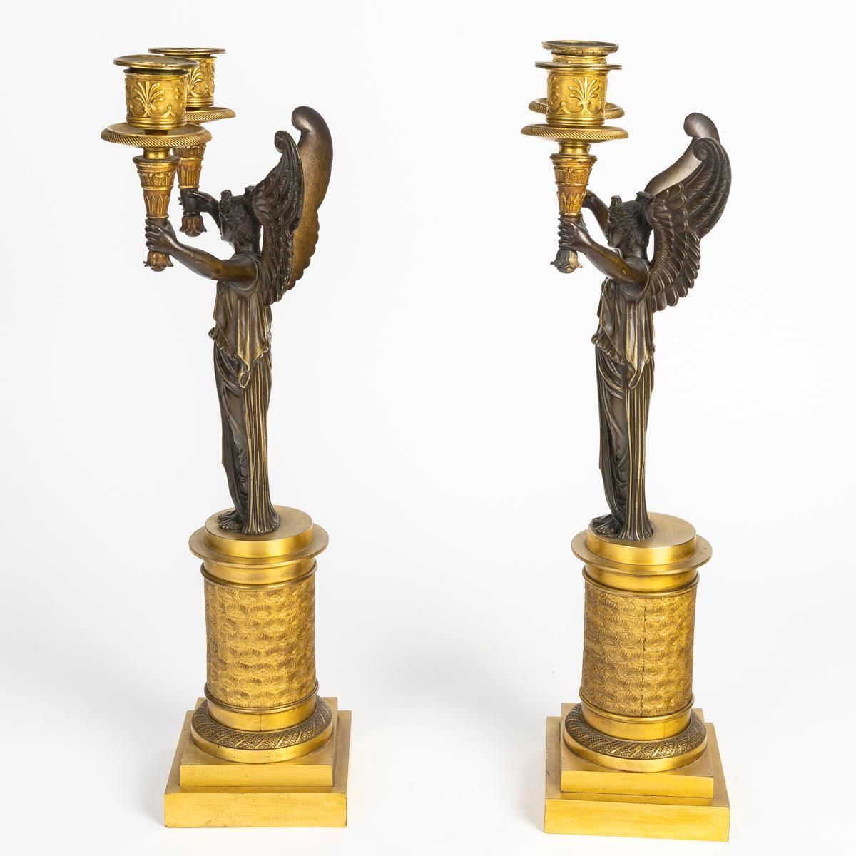 A Pair Of Gilt Bronze And Patinated Candelabra With Winged Victories. photo for sale