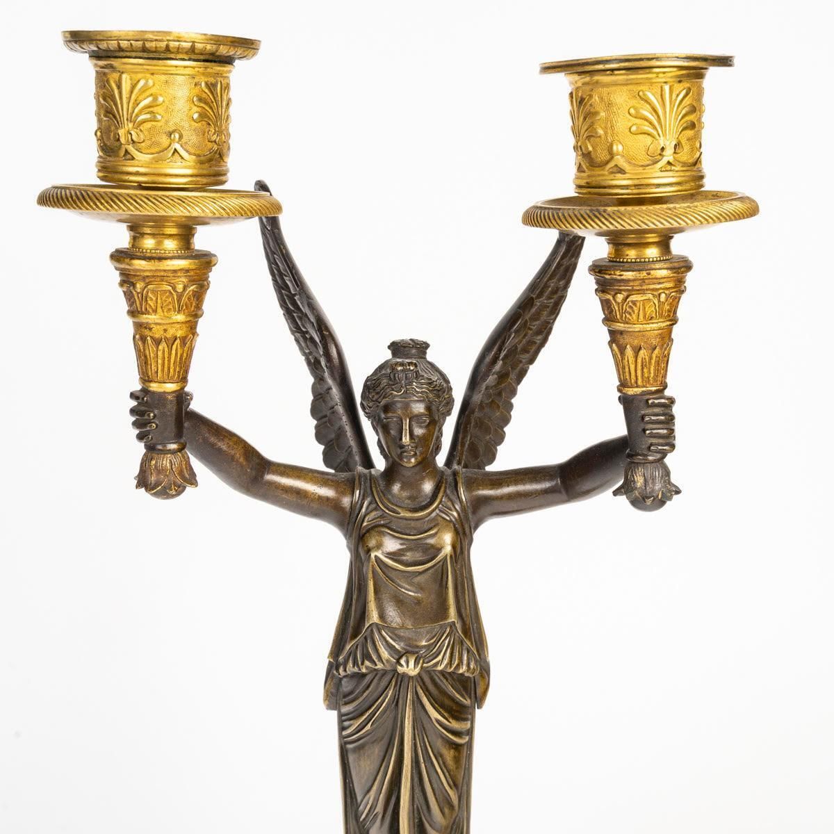 A Pair Of Gilt Bronze And Patinated Candelabra With Winged Victories. photo vinterior