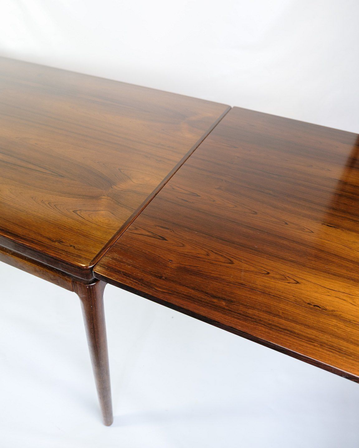 Dining Table With Extension In Rosewood By Johannes Andersen For Chr. Linneberg From 1960s photo vinterior
