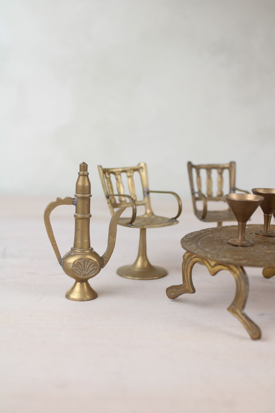 photo furniture Set Of Miniature Brass Chairs And A Table