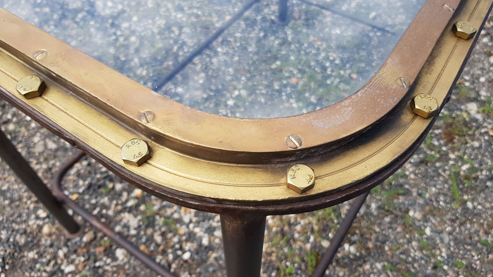 photo furniture Table With Old Brass Ship's Porthole With Iron Base / 110 X 70 X 76 Cm