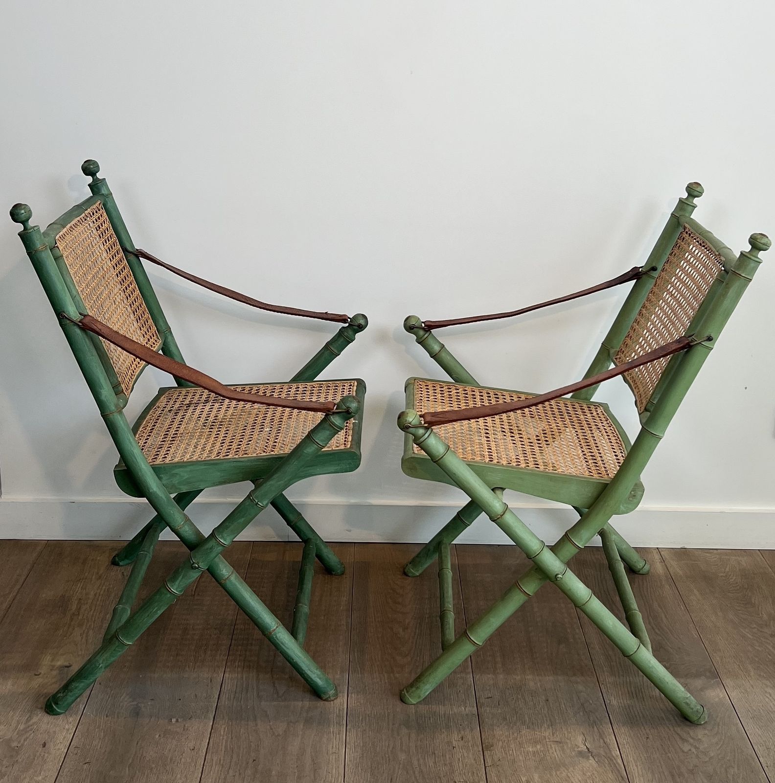 Pair Of Folding Safari Chairs In Weathered Faux Bamboo Style With Caned Backs And Seats And Leather Armrests photo 1450.0