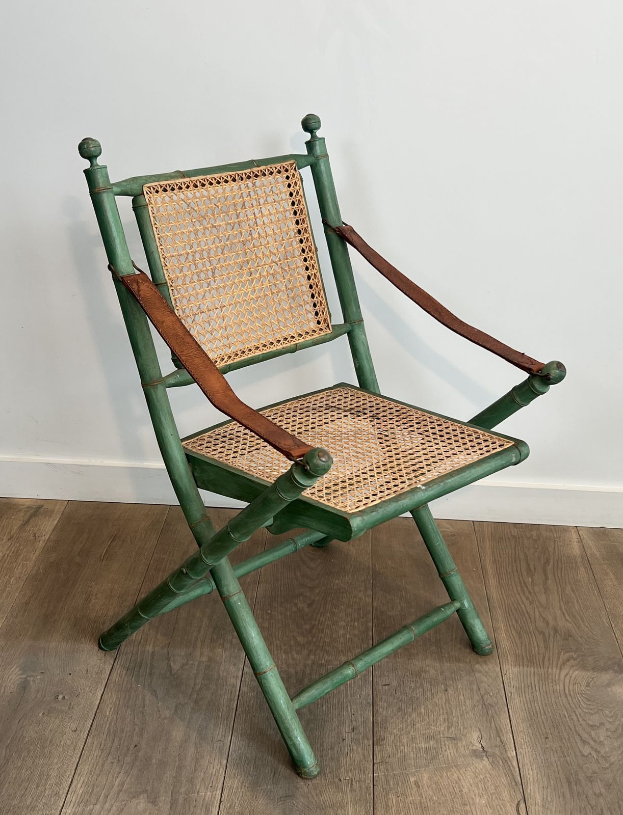 Pair Of Folding Safari Chairs In Weathered Faux Bamboo Style With Caned Backs And Seats And Leather Armrests photo vinterior