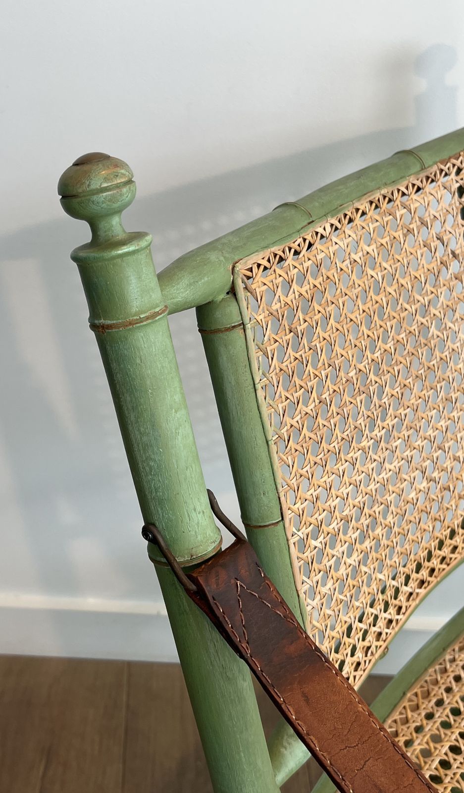 photo furniture Pair Of Folding Safari Chairs In Weathered Faux Bamboo Style With Caned Backs And Seats And Leather Armrests