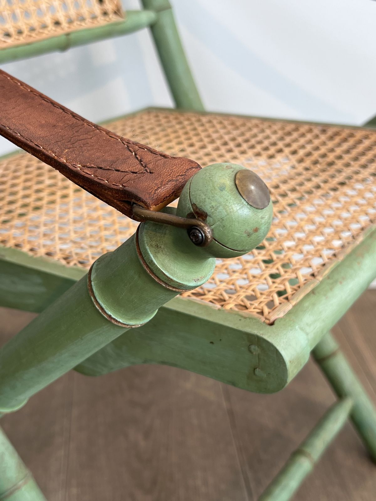Furniture Pair Of Folding Safari Chairs In Weathered Faux Bamboo Style With Caned Backs And Seats And Leather Armrests photo
