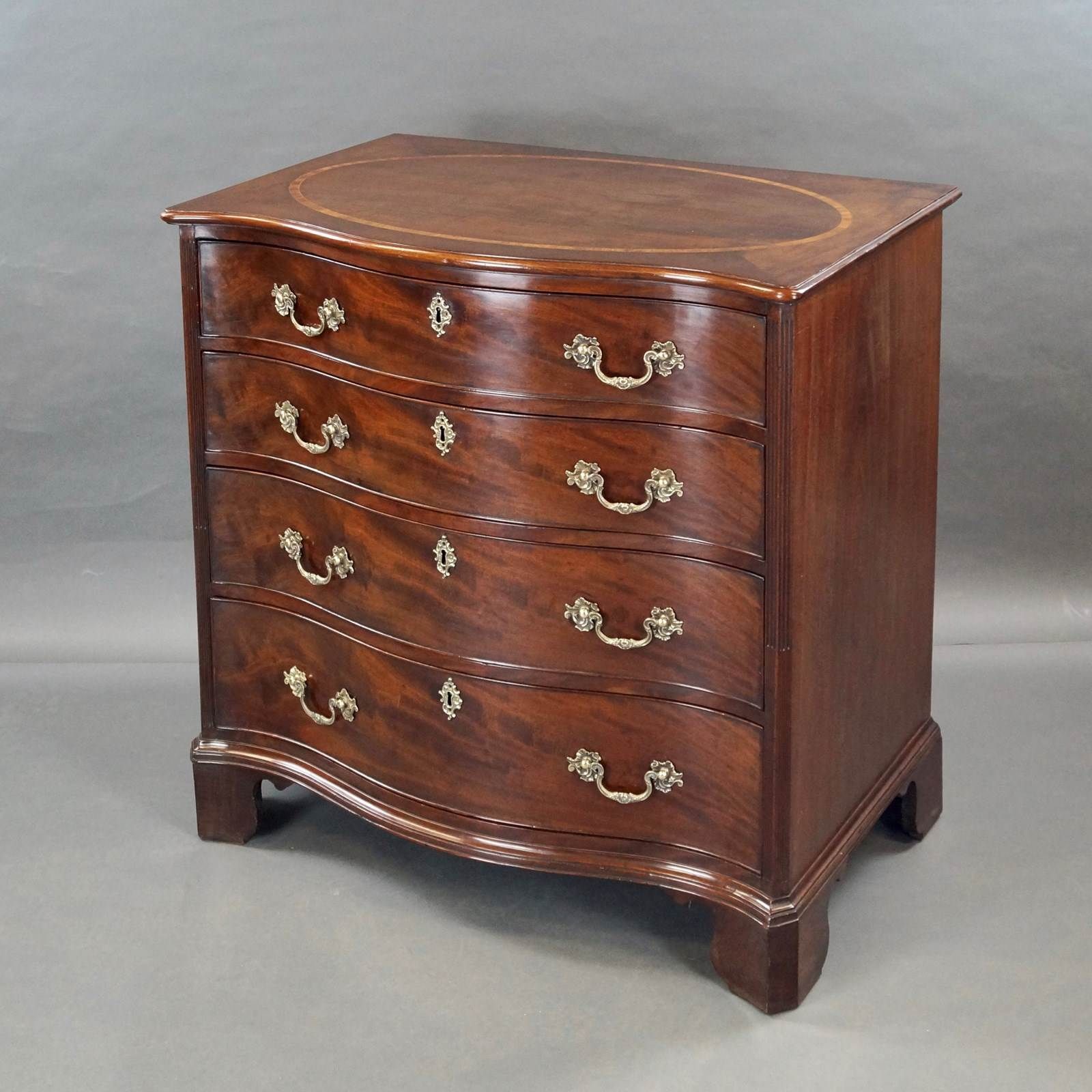 A George III Serpentine Chest Of Drawers photo furniture