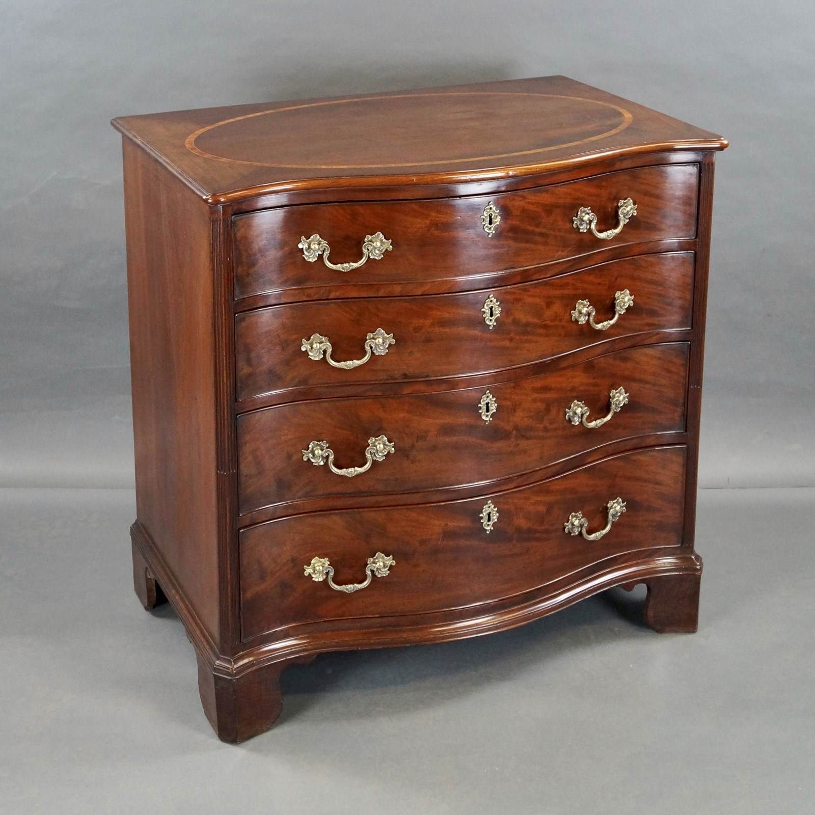 A George III Serpentine Chest Of Drawers photo for sale