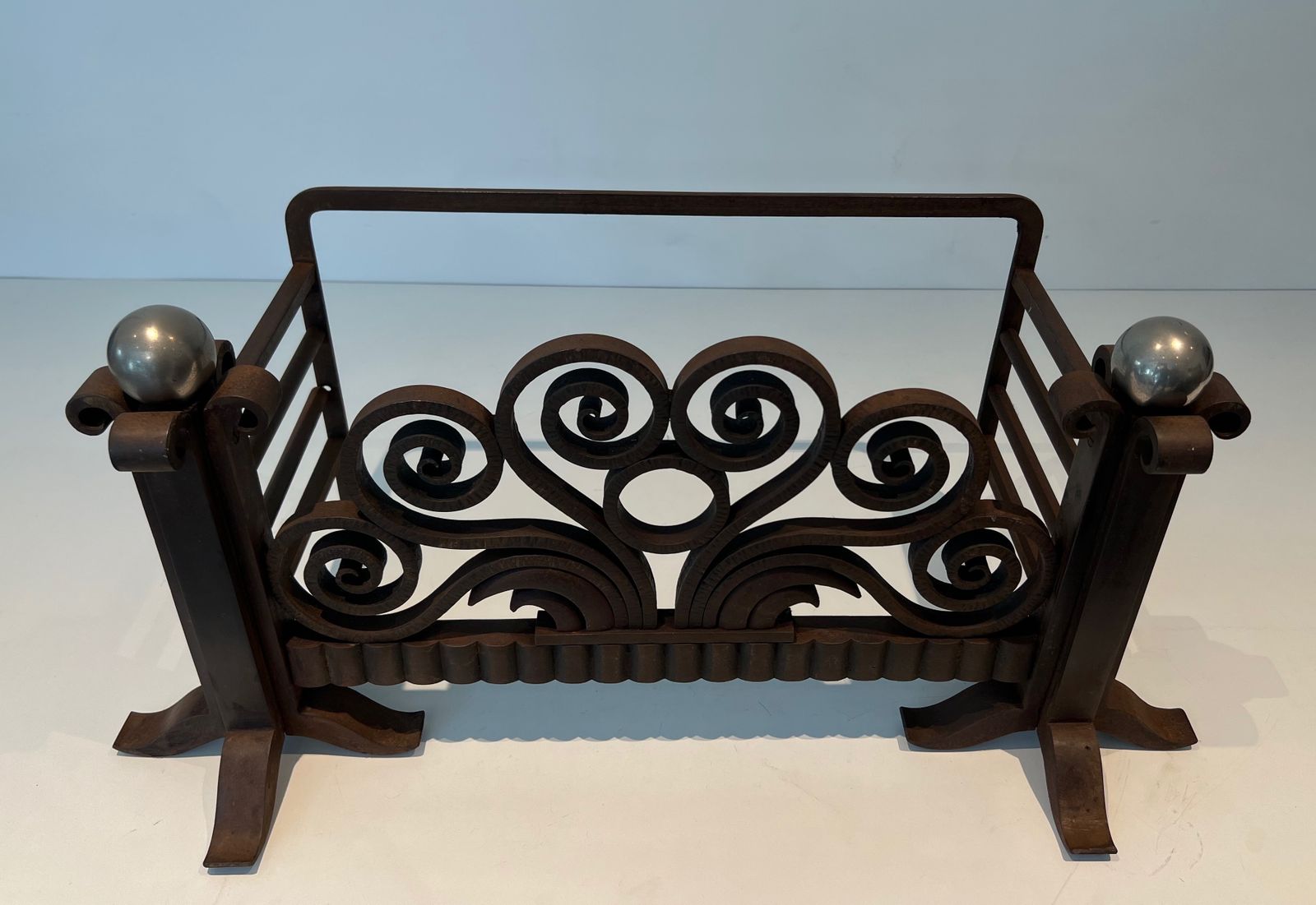 Log Basket Or Andirons In Hammered Wrought Iron And Chrome In The Style Of Edgar Brandt. Circa 1930 photo furniture
