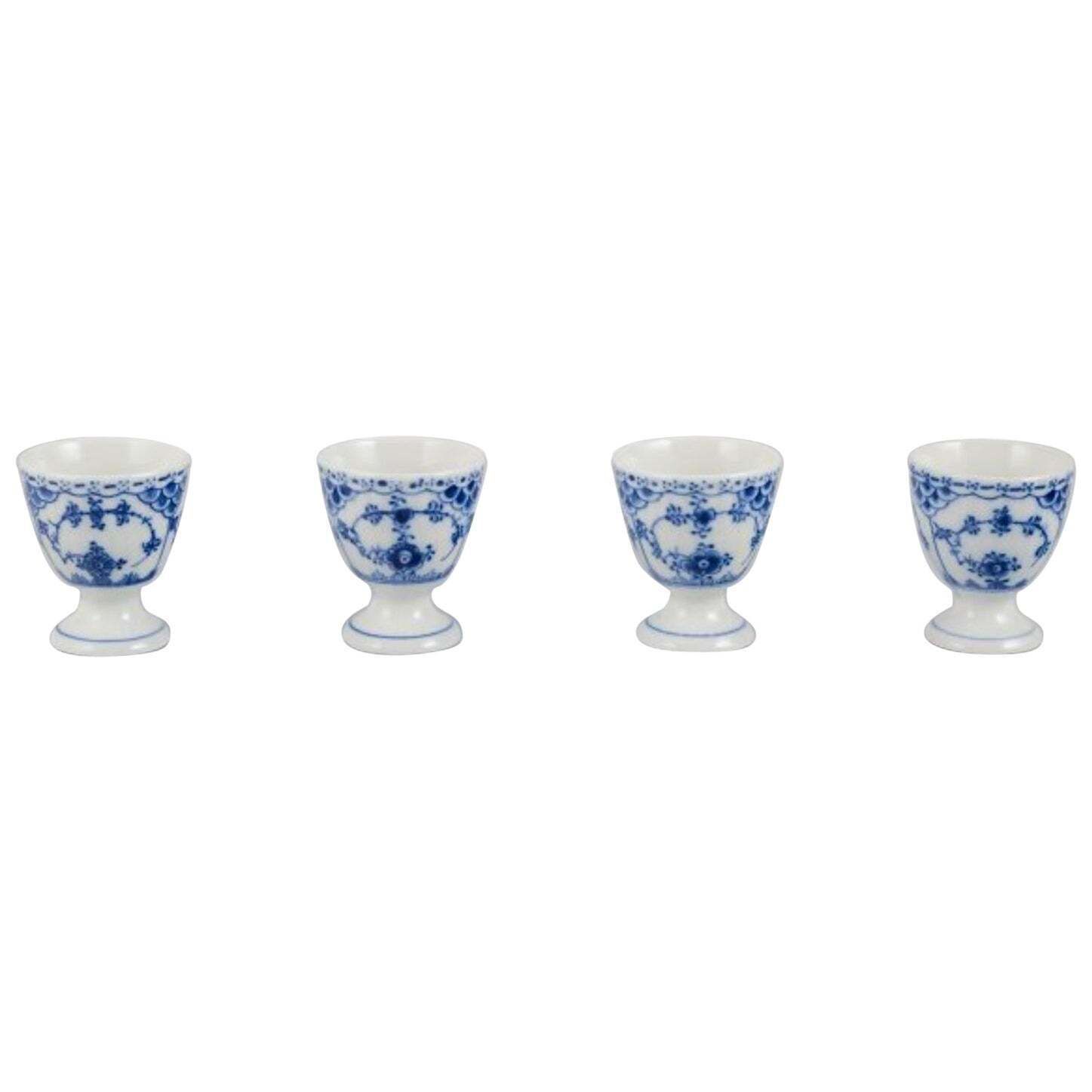 Royal Copenhagen Blue Fluted Half Lace, Set Of Four Egg Cups In Porcelain.