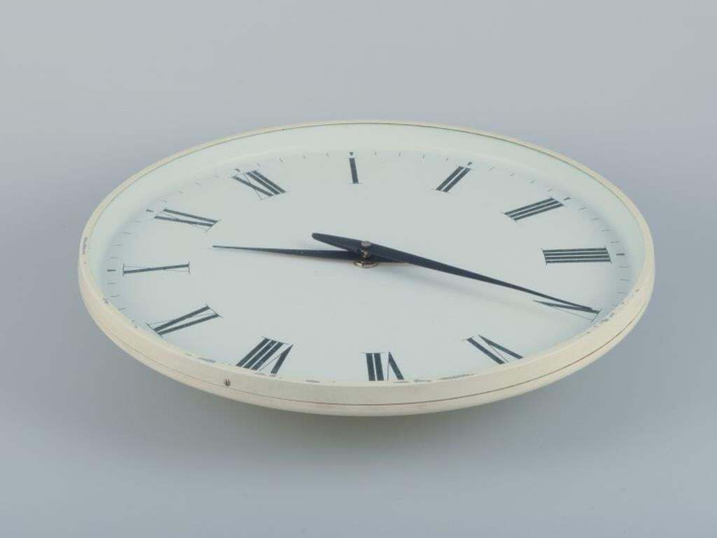 Henning Koppel For Georg Jensen. Wall Clock Made Of White Plastic And Metal. photo furniture