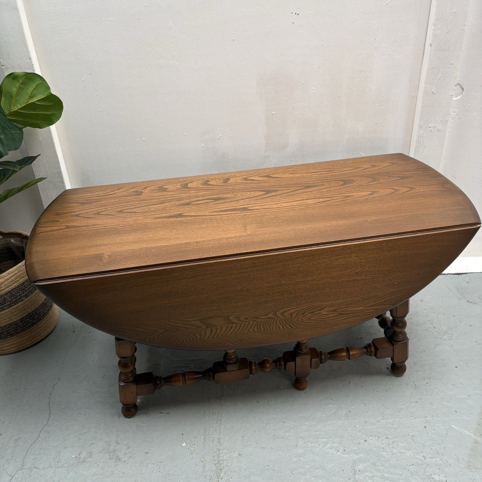 Ercol Trinity Solid Elm 2 Tier Drop Leaf Coffee Table In Golden Dawn photo for sale