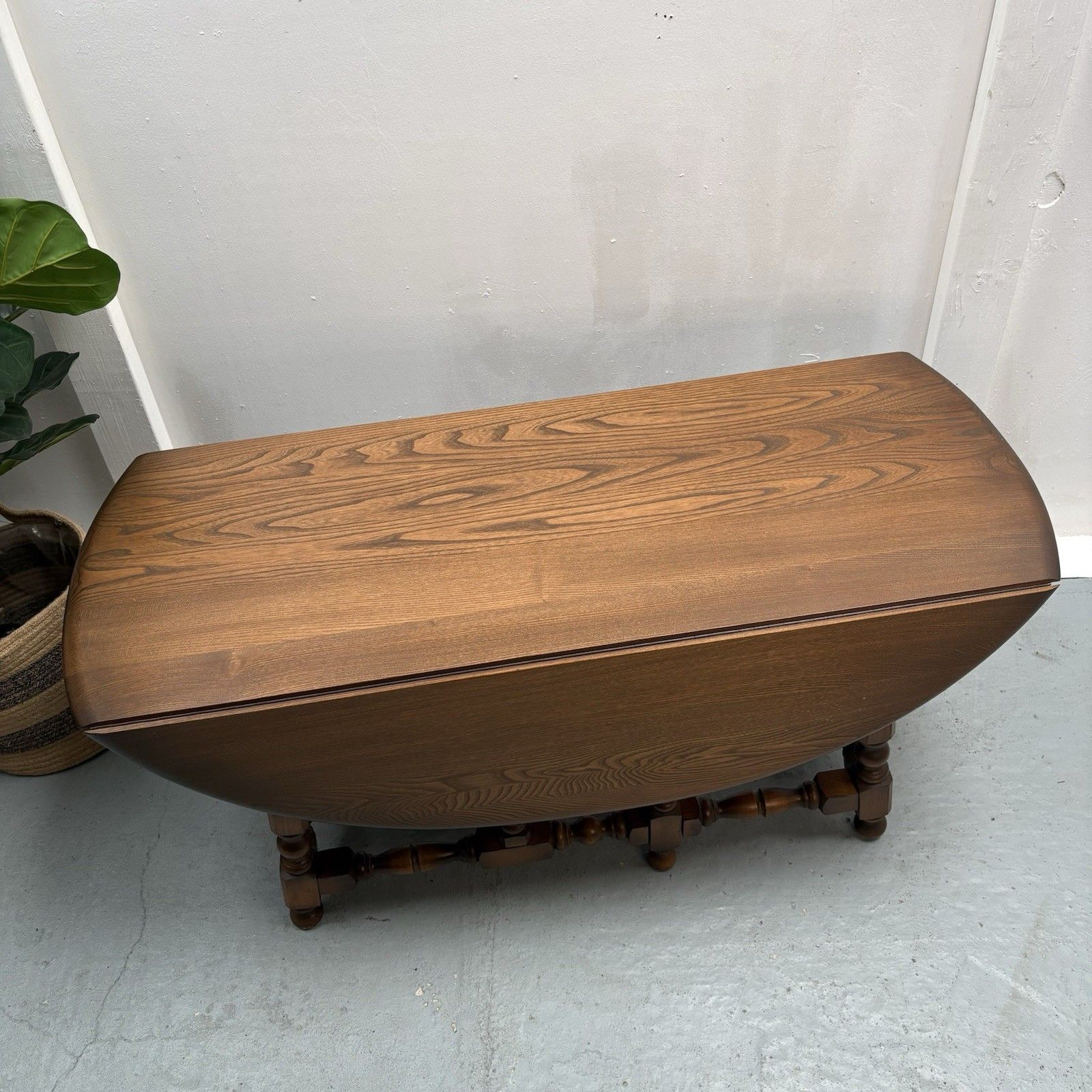 Ercol Trinity Solid Elm 2 Tier Drop Leaf Coffee Table In Golden Dawn photo Furniture