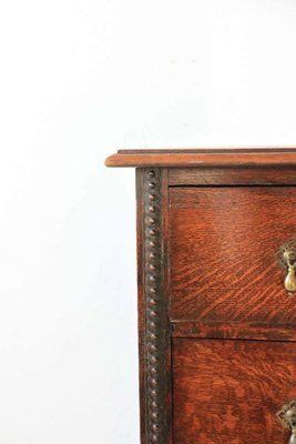 Antique Oak Chest Of Drawers On Castors With Brass Handles And Carved Details photo Furniture