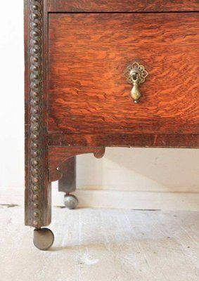 Antique Oak Chest Of Drawers On Castors With Brass Handles And Carved Details photo 2169.0