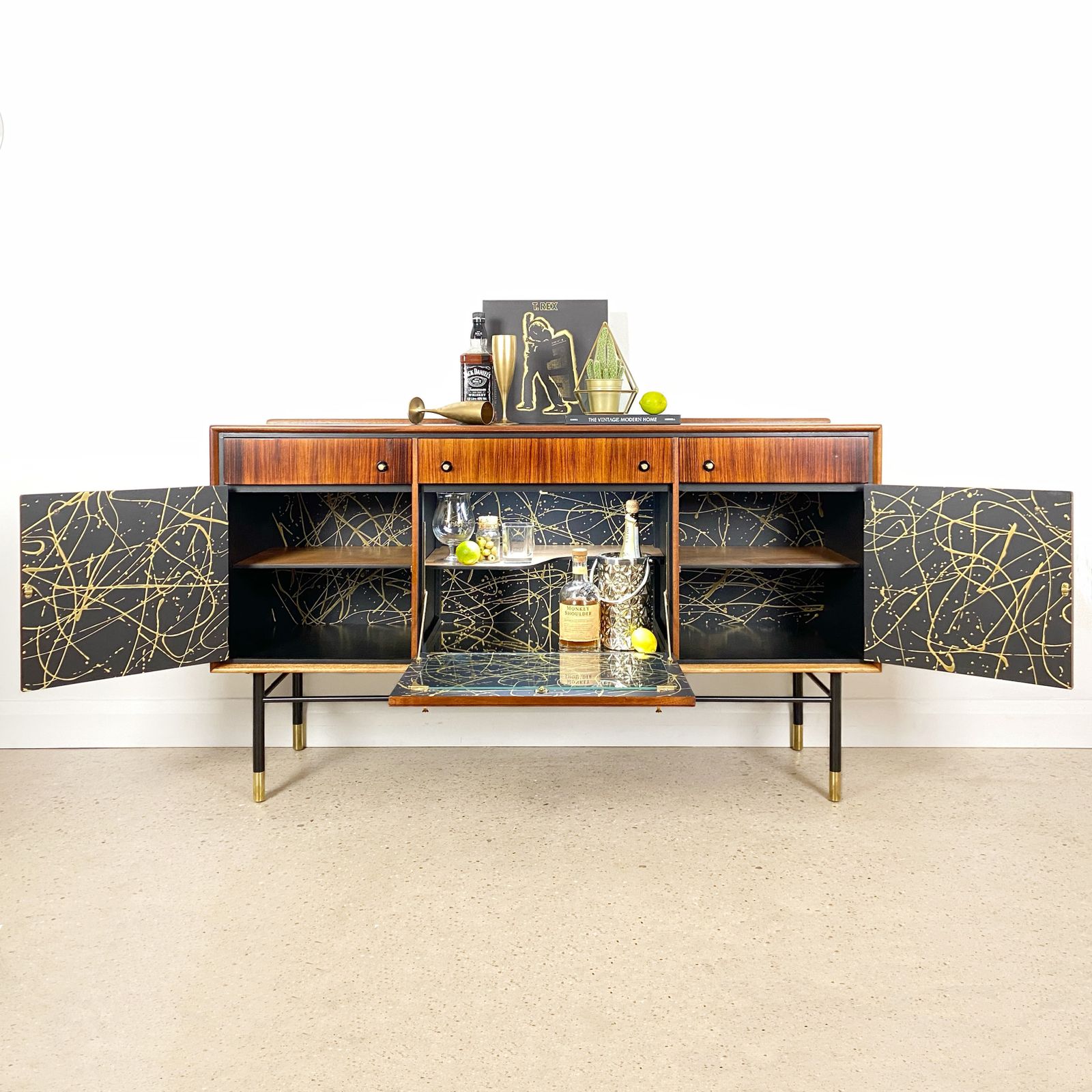 Mid Century Cocktail Bar Drinks Cabinet By Heal's In Rosewood And Brass With Black & Gold Jackson Pollock Paint Effect photo furniture