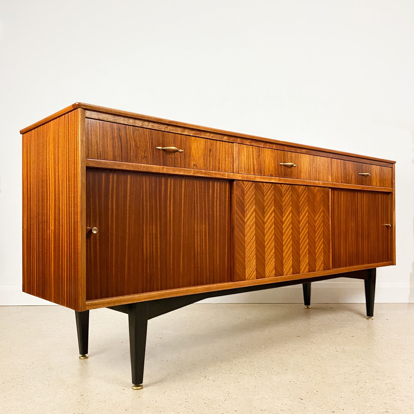 Mid Century Sideboard By Jentique In Teak Rosewood Tola With Black And Gold Chevron Design And Light photo furniture