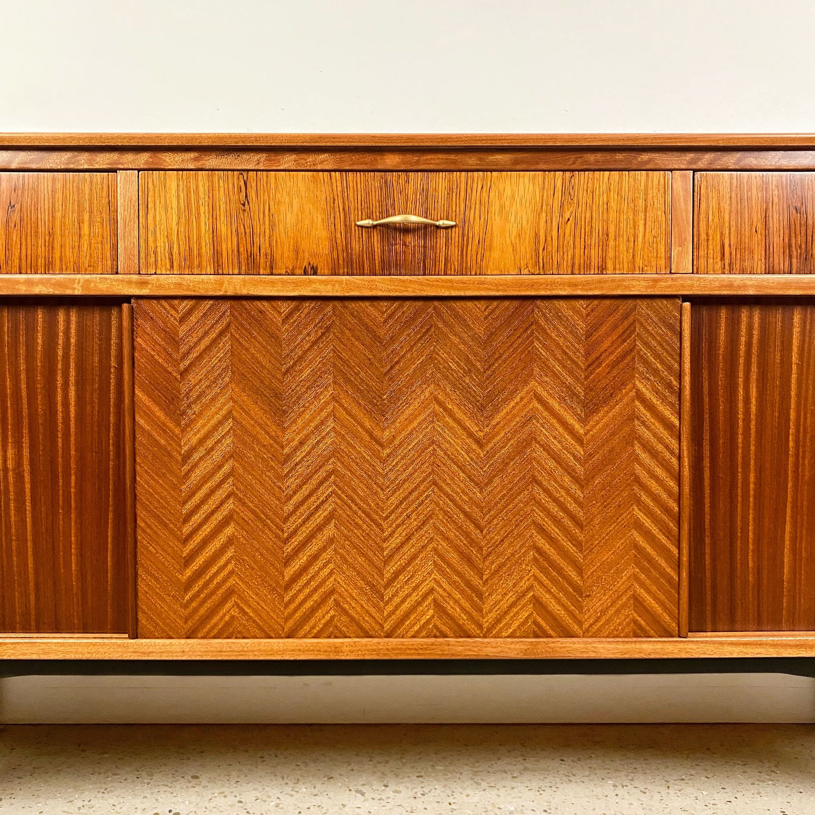 photo for sale Mid Century Sideboard By Jentique In Teak Rosewood Tola With Black And Gold Chevron Design And Light