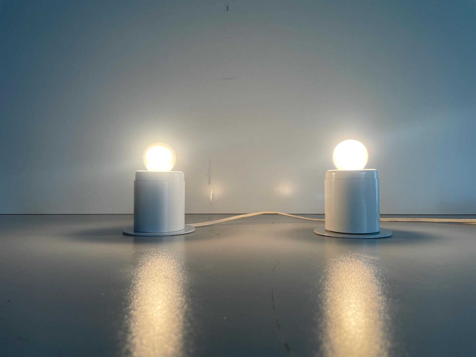 Minimal Design Pair Of White Metal Wall Lamps Still Of Artemide, 1970s, Italy