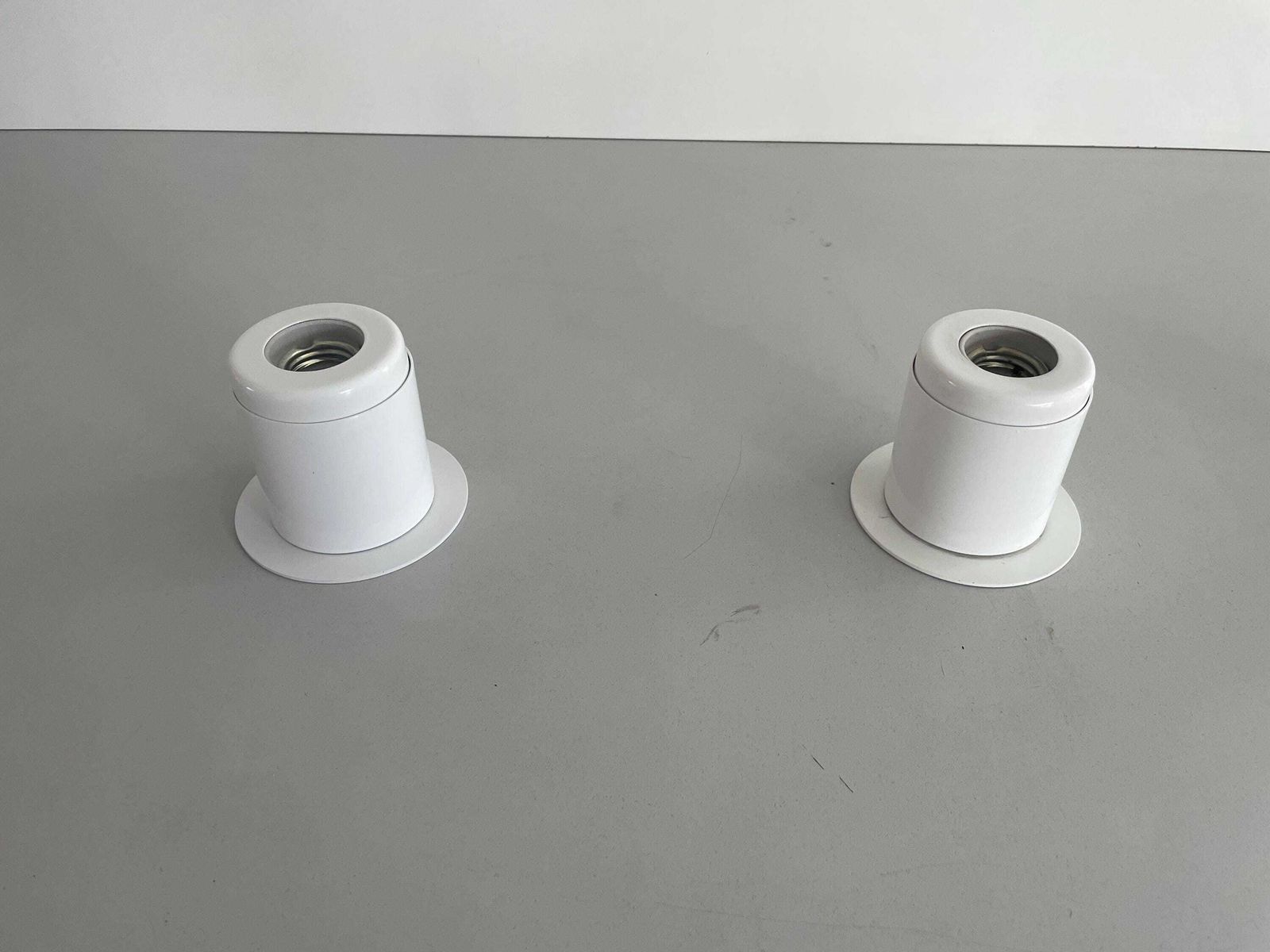 photo furniture Minimal Design Pair Of White Metal Wall Lamps Still Of Artemide, 1970s, Italy