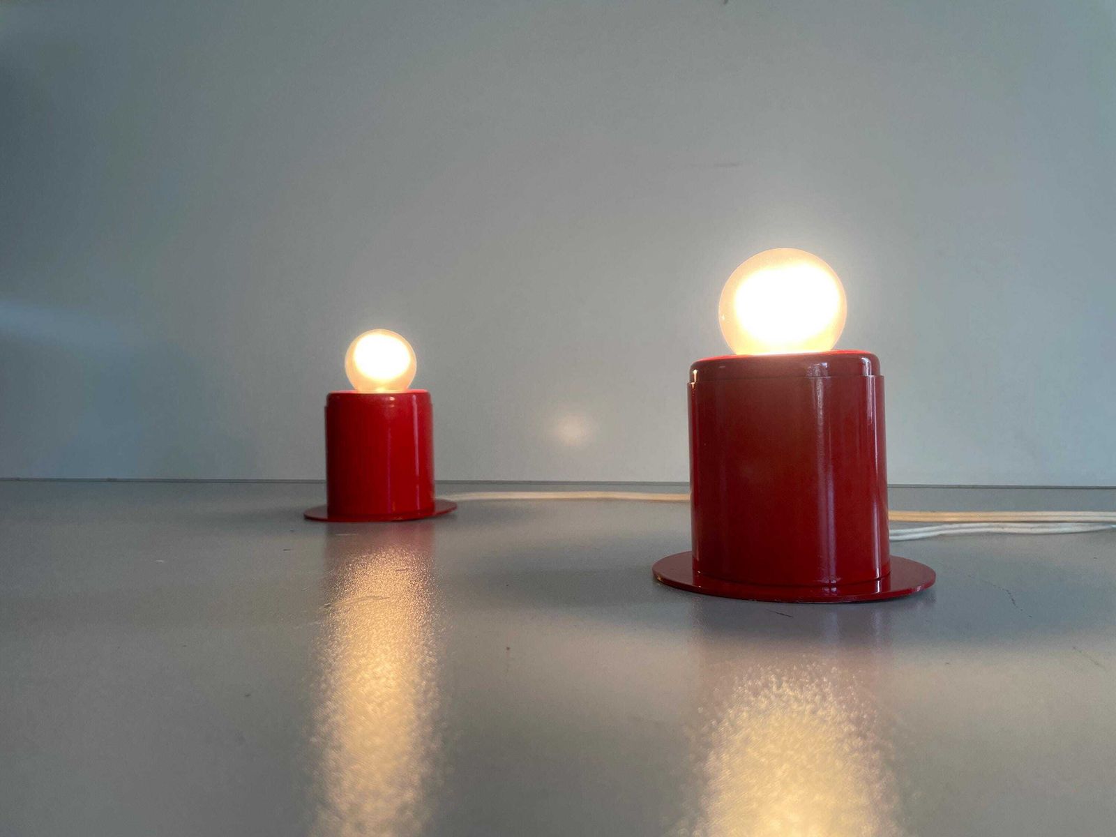 photo furniture Minimal Design Pair Of Orange Metal Wall Lamps Still Of Artemide, 1970s, Italy