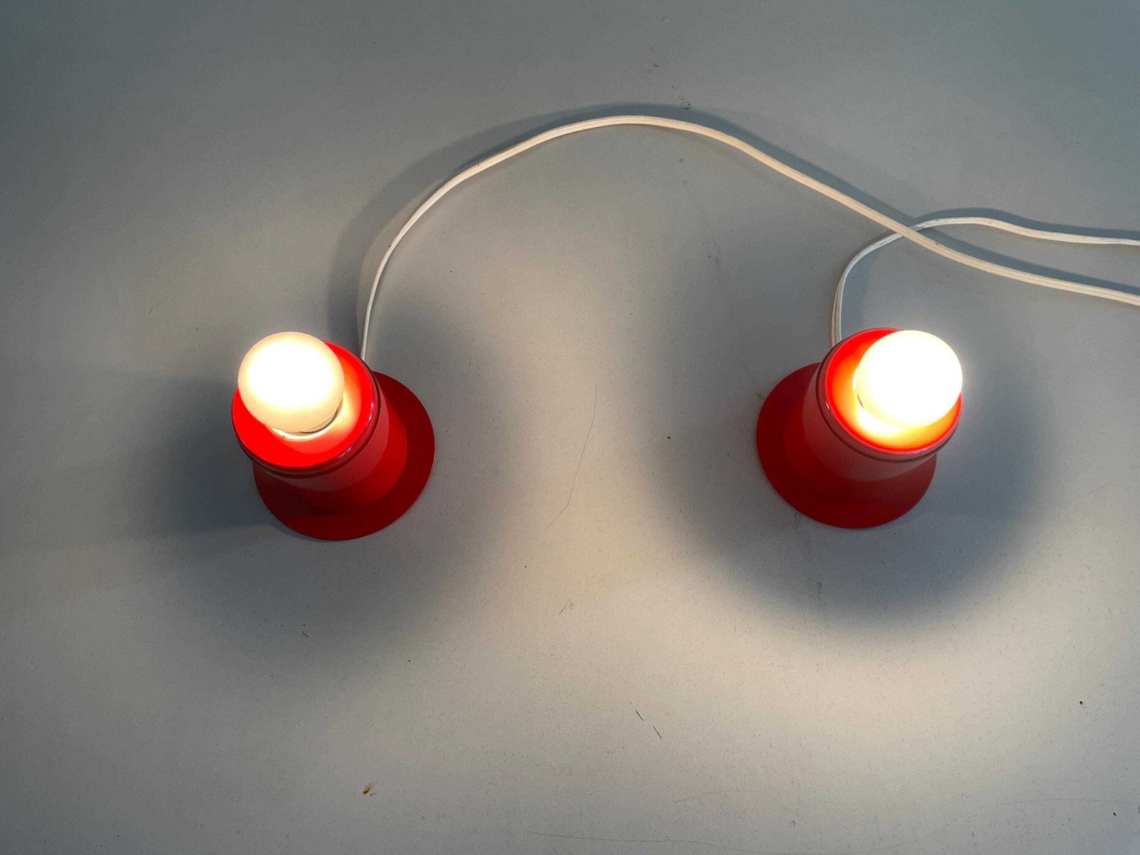 photo for sale Minimal Design Pair Of Orange Metal Wall Lamps Still Of Artemide, 1970s, Italy