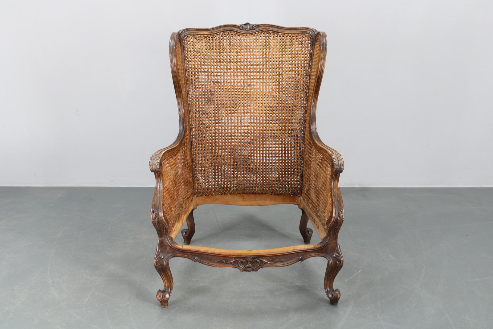 photo buy Antique Carved Wing Chair With Cane Sides , Czechoslovakia