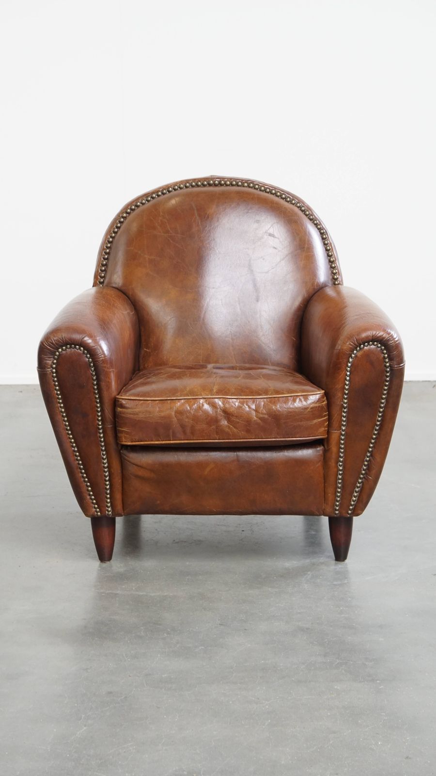 Characterful And Timeless Cowhide Design Armchair With Beautiful Round Shapes And Decorative Nails photo furniture