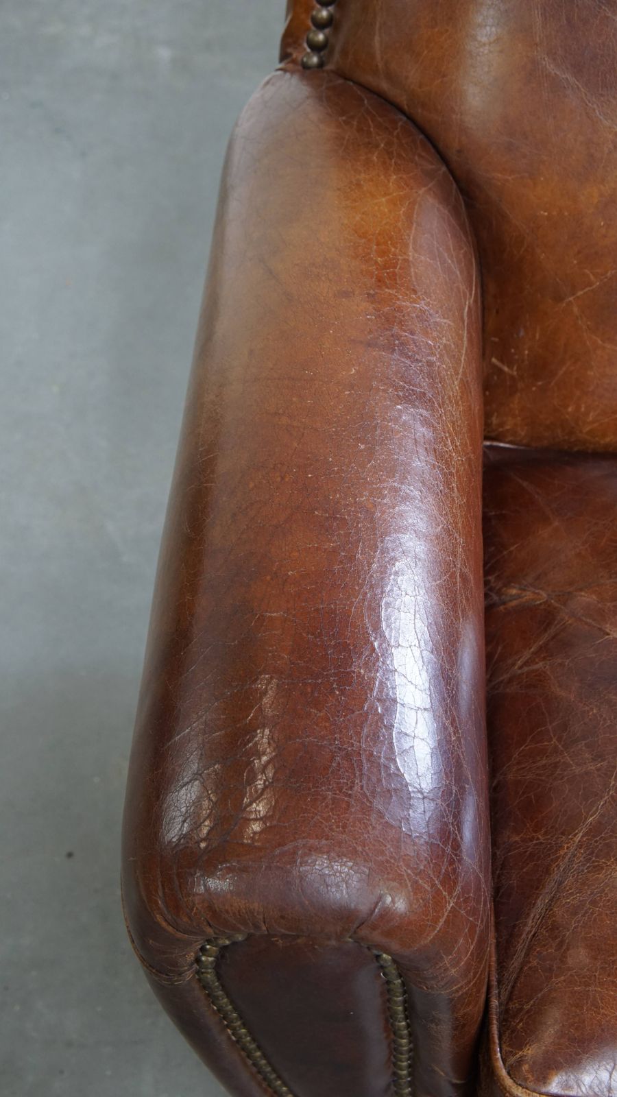 Characterful And Timeless Cowhide Design Armchair With Beautiful Round Shapes And Decorative Nails photo buy