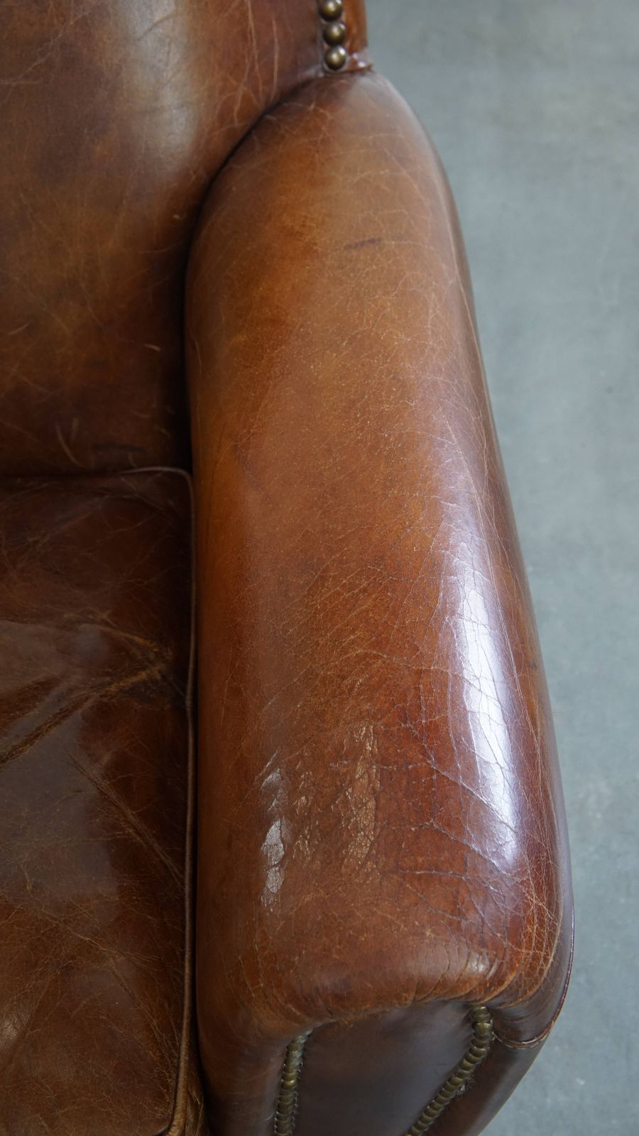 Characterful And Timeless Cowhide Design Armchair With Beautiful Round Shapes And Decorative Nails photo vintage