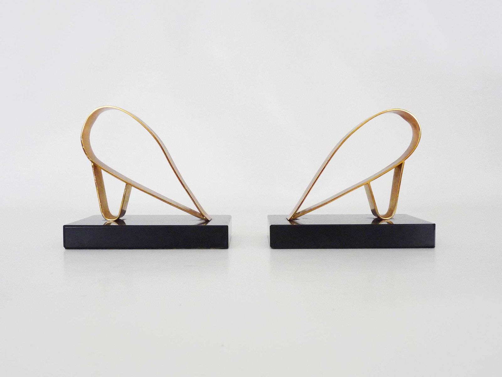 Pair Of Modernist Art Deco Gold Starry Bookends On A Black Marble Base. photo furniture