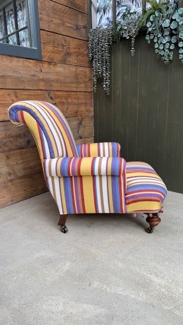 Traditionally Upholstered Country House Lounge Armchair With Brass Castors photo furniture