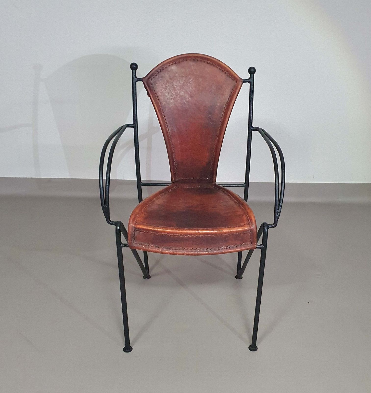 photo furniture 24 Chairs In Leather And Solid Wrought Iron