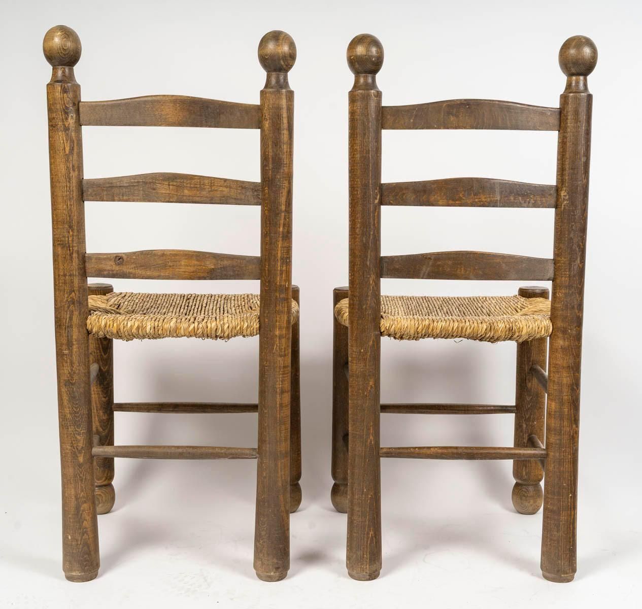 photo furniture Set Of Six Charles Dudouyt Dining Chairs In Wood And Cane, 20th Century.