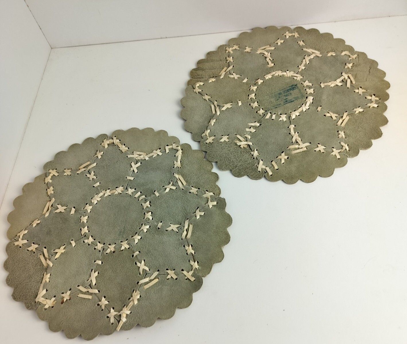 2 Pieces Of Cowhide Patchwork Round Table Mats Marked Vintage Hand Laced photo vintage