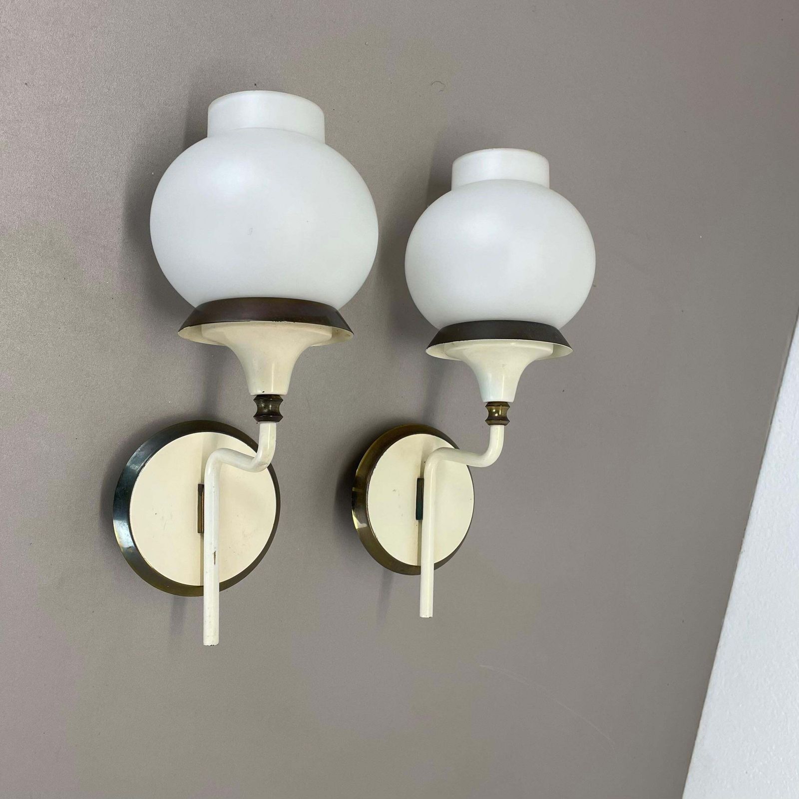 Set Of Two Brutalist Brass And White Glass Wall Light Sconces, France 1960s photo furniture