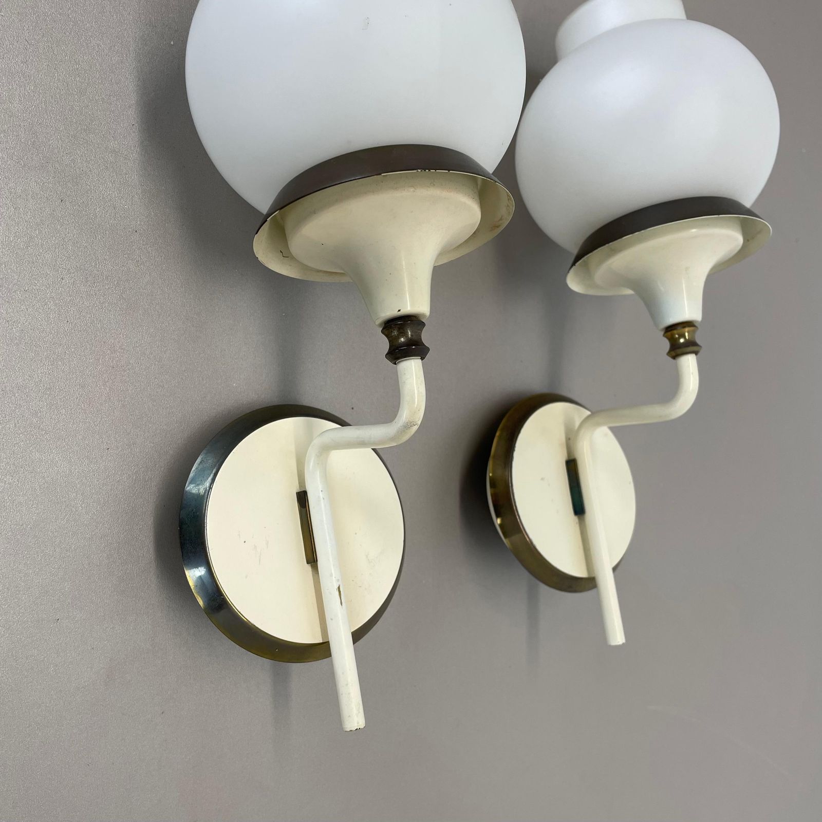 photo for sale Set Of Two Brutalist Brass And White Glass Wall Light Sconces, France 1960s