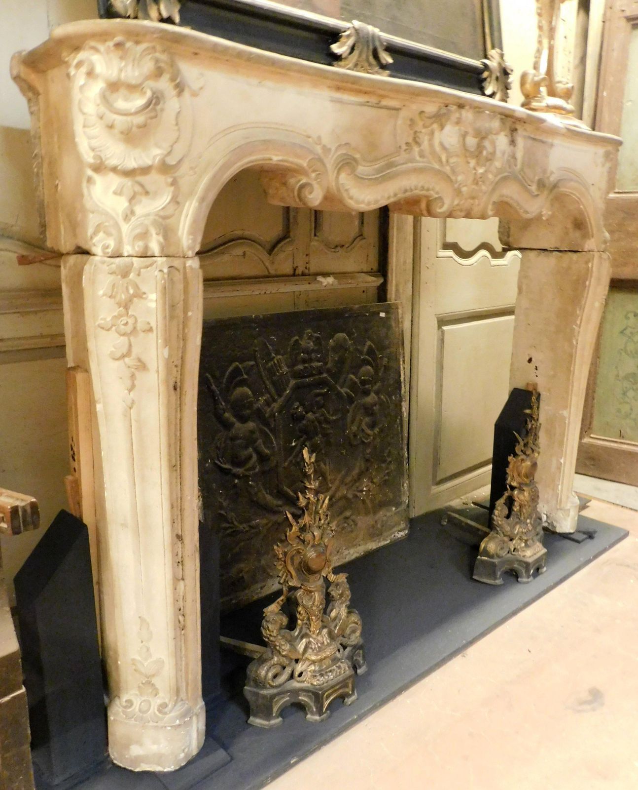 photo furniture Fireplace Mantle In Richly Carved Burgundy Stone And Wavy Shape, Italy