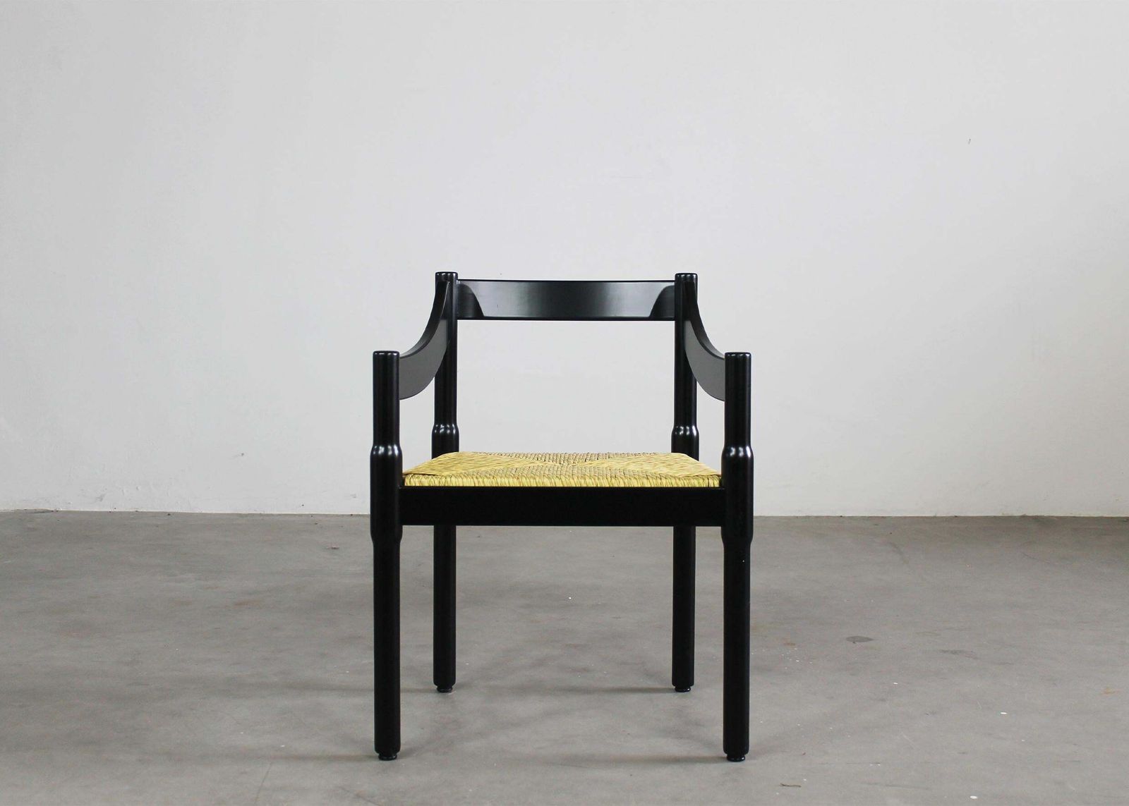 photo for sale Vico Magistretti Set Of Twelve Black Carimate Chairs By Cassina 1960s