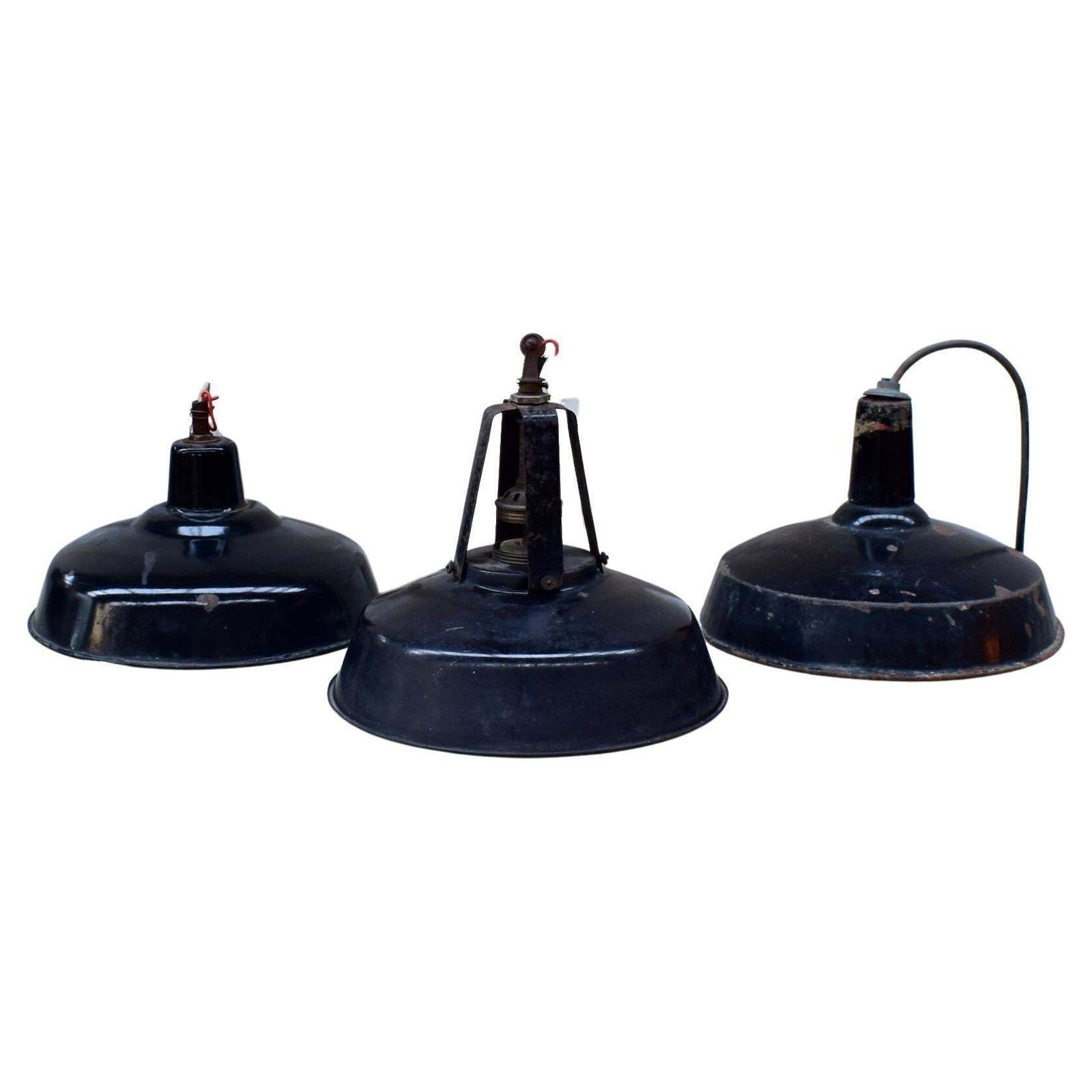 A Set Of Industrial Black Enamel Hanging Lamps Circa 1940s