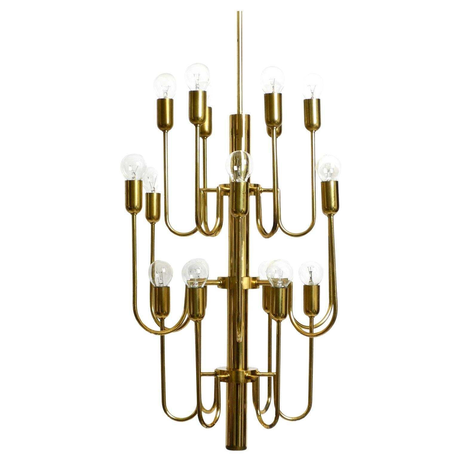 Beautiful Three Staged 18 Arm Mid Century Brass Chandelier With A Long Brass Rod