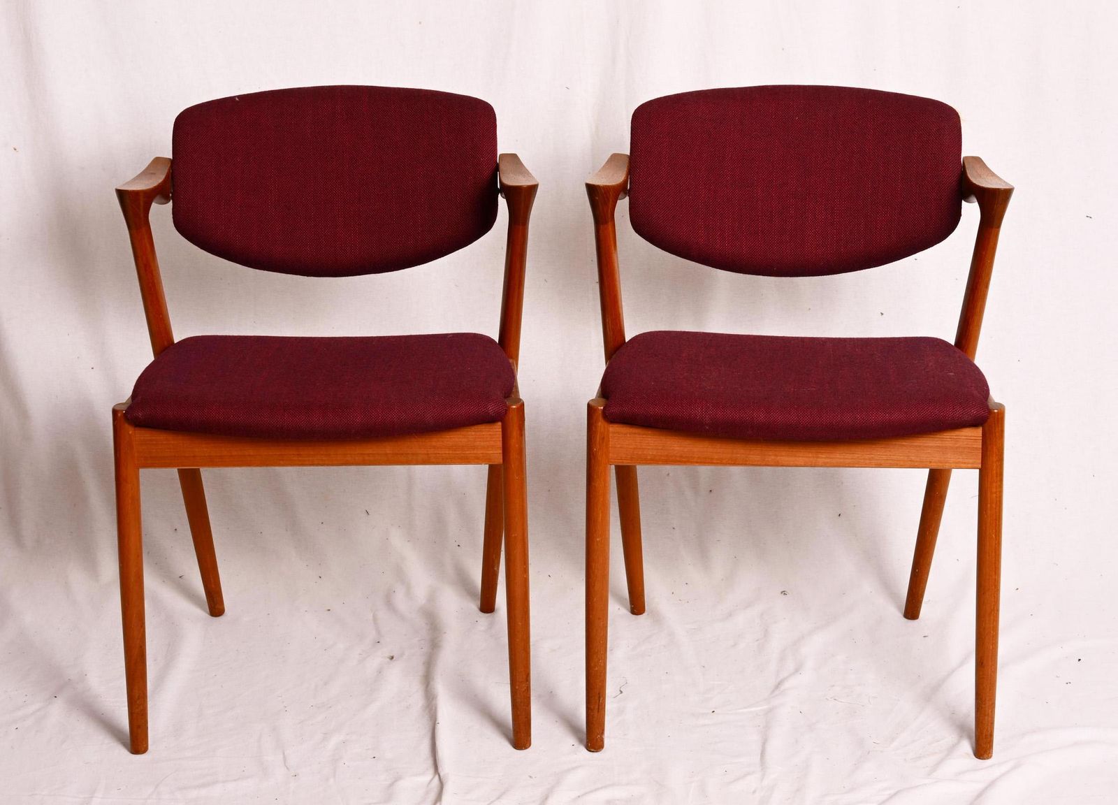 A Pair Of Teak Dining Chairs By Kai Kristiansen Model 42 photo vinterior